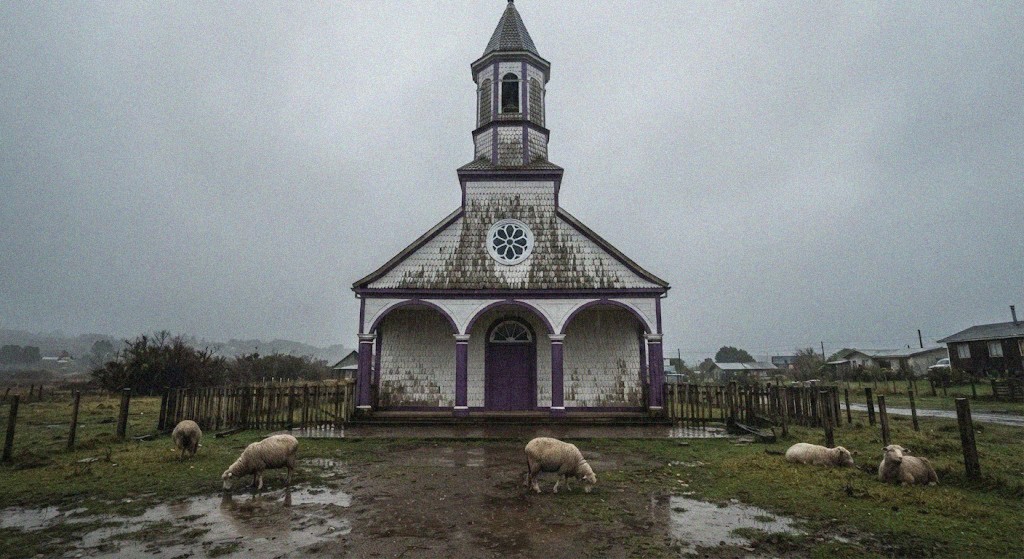Shingled wooden church under grey sky